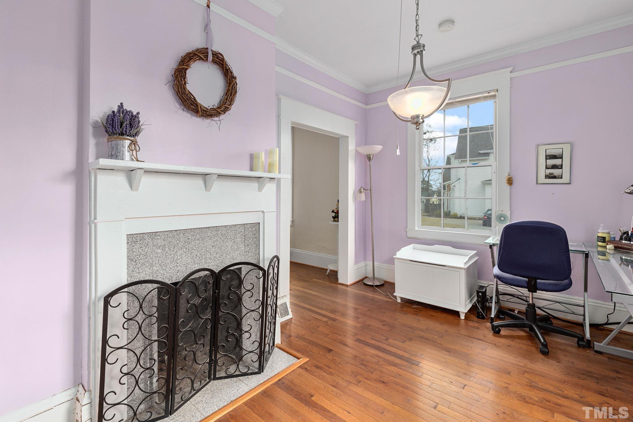 330 Pershing Road Raleigh, NC 27608 - Photo 9 of 51 a living room with furniture and a fireplace