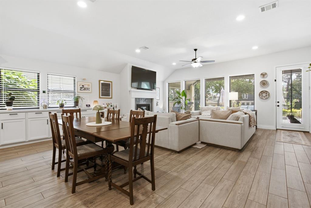 904 Fallbrook Avenue Denton, TX 76210 - Photo 13 of 30 a view of a dining room with furniture window and wooden floor