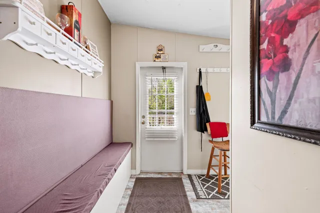 a view of a room with a potted plant and wooden floor