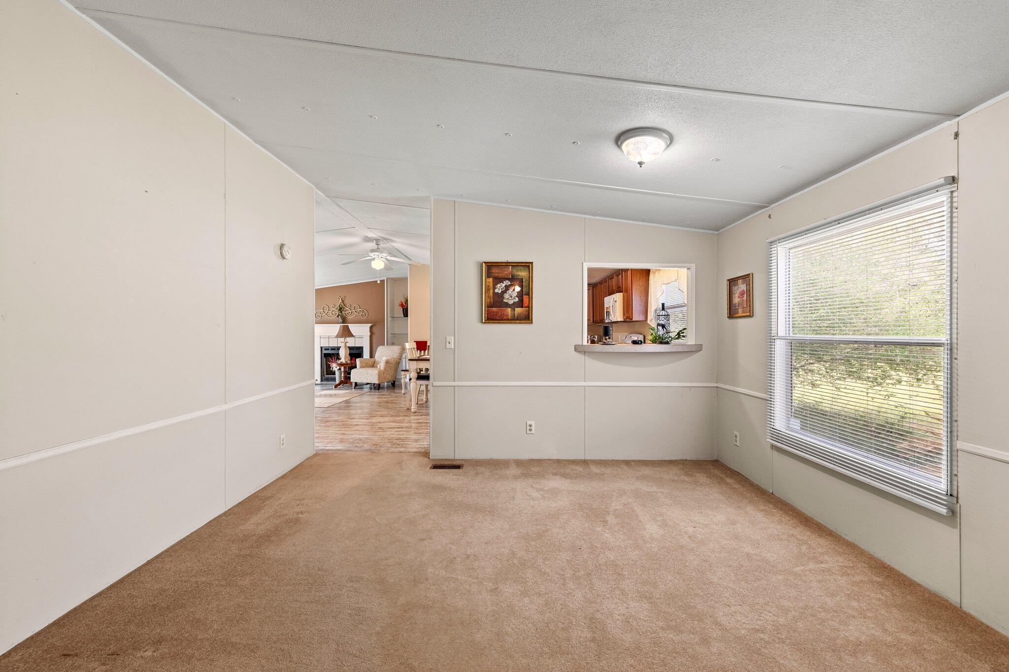 3062 Highland Avenue Crestview, FL 32539 - Photo 17 of 58 a room with furniture and a window