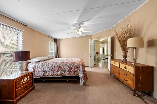 a bedroom with a bed and dresser