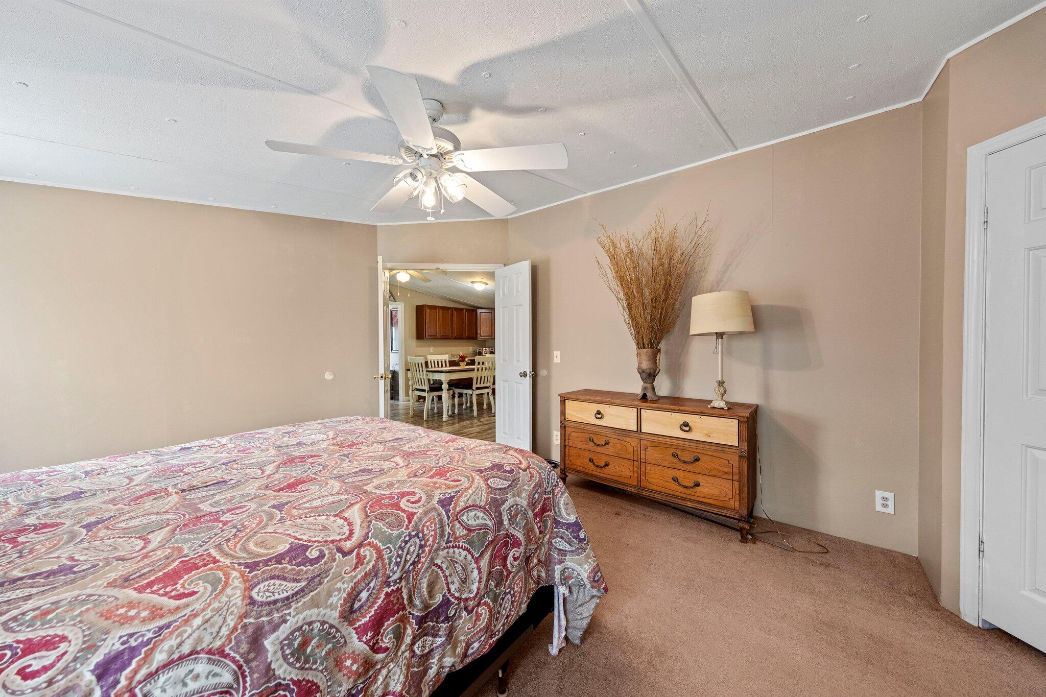 3062 Highland Avenue Crestview, FL 32539 - Photo 27 of 58 a bedroom with a bed and dresser