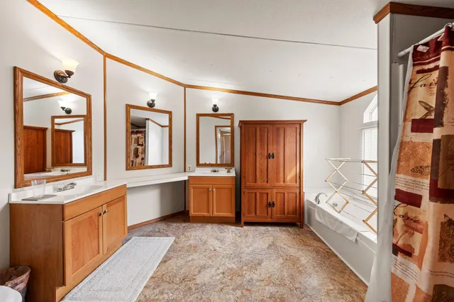 a kitchen with a stove a sink and a refrigerator