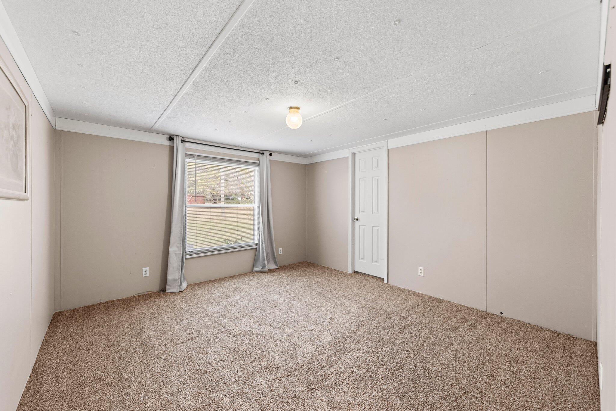 3062 Highland Avenue Crestview, FL 32539 - Photo 35 of 58 a view of an empty room with a window