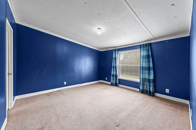 aerial view of a house with a yard table and chairs