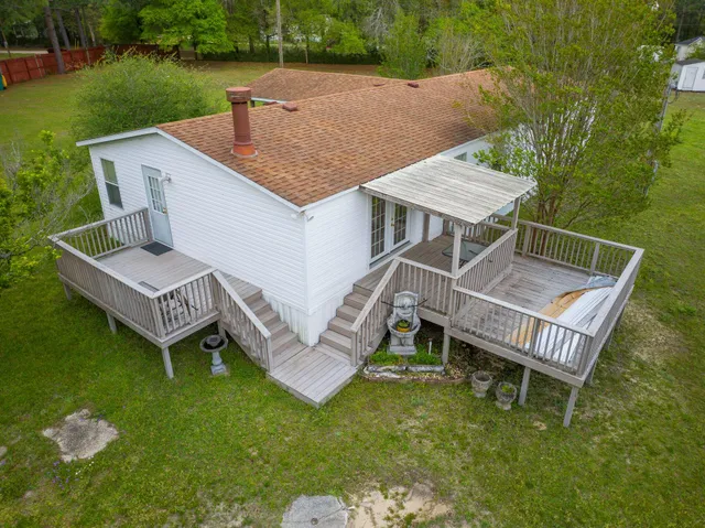 a view of balcony with wooden floor