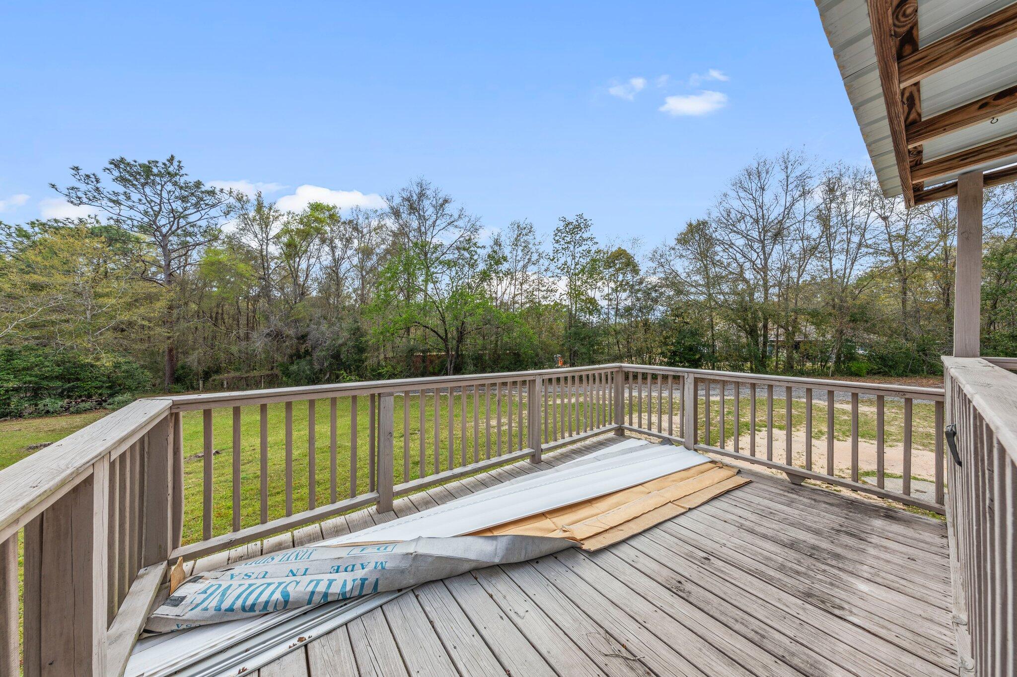 3062 Highland Avenue Crestview, FL 32539 - Photo 45 of 58 a view of balcony with wooden floor and fence