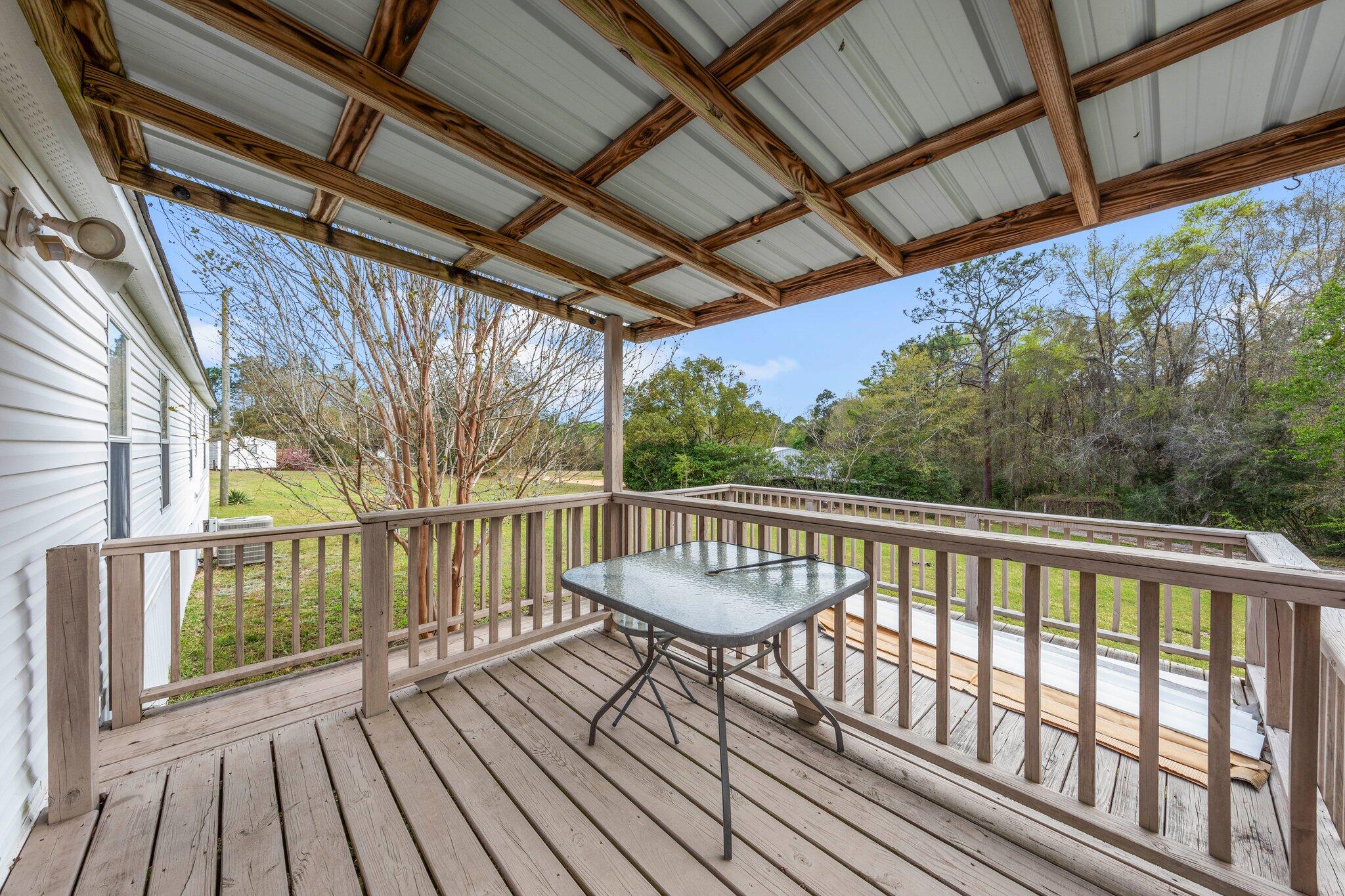 3062 Highland Avenue Crestview, FL 32539 - Photo 47 of 58 a view of balcony with wooden floor