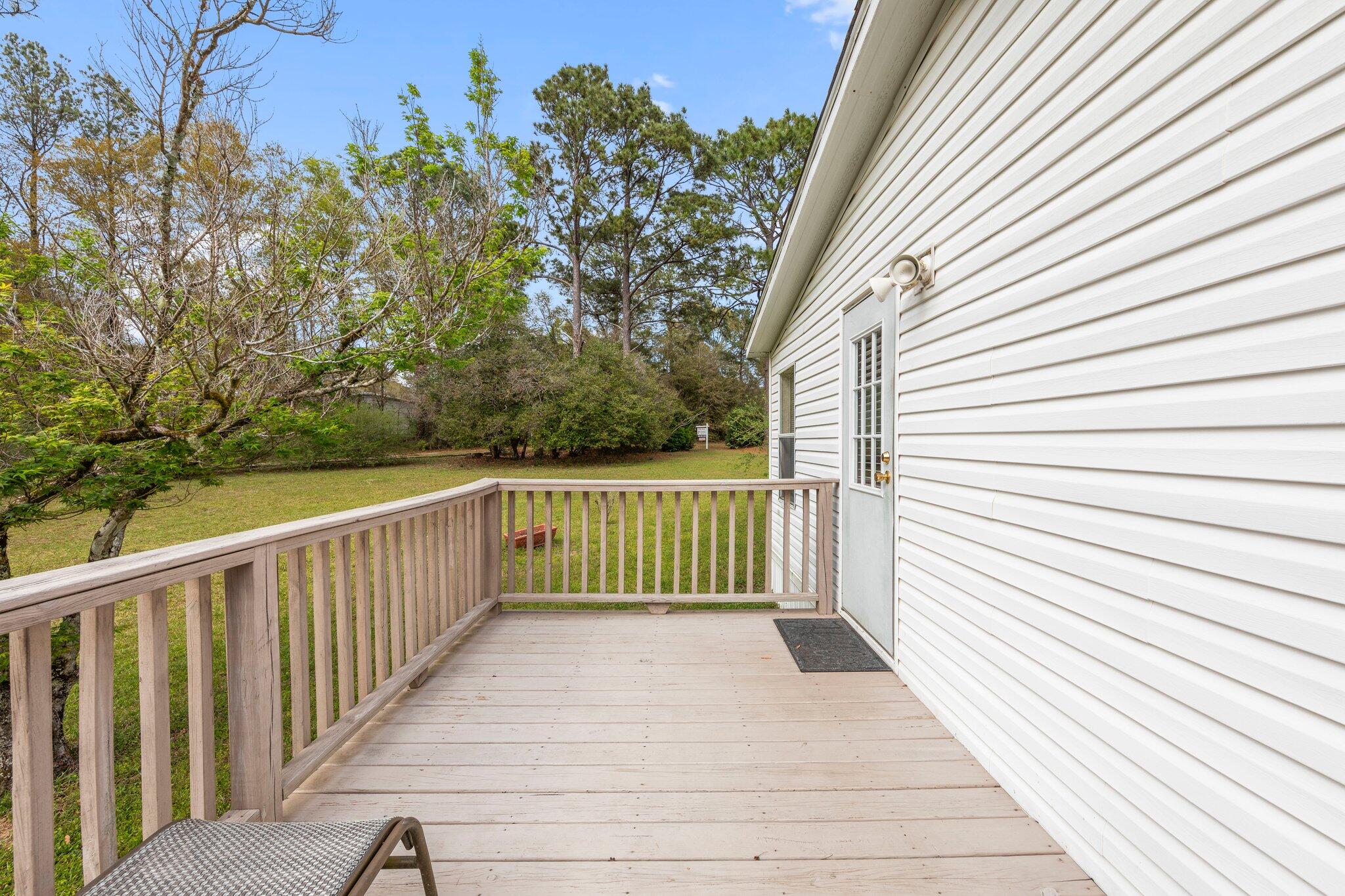 3062 Highland Avenue Crestview, FL 32539 - Photo 49 of 58 a view of a wooden deck