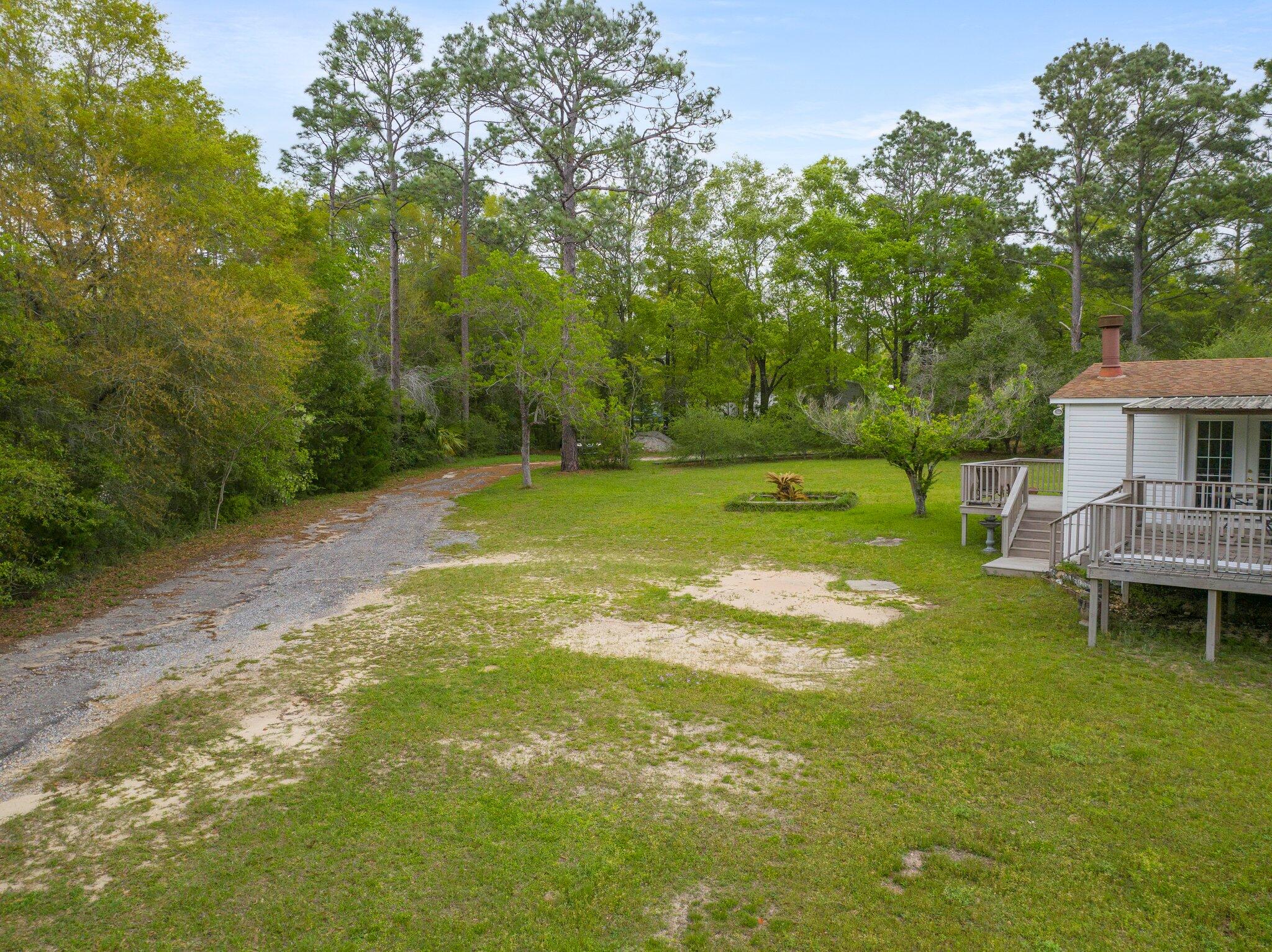 3062 Highland Avenue Crestview, FL 32539 - Photo 51 of 58 a view of a swimming pool with a patio