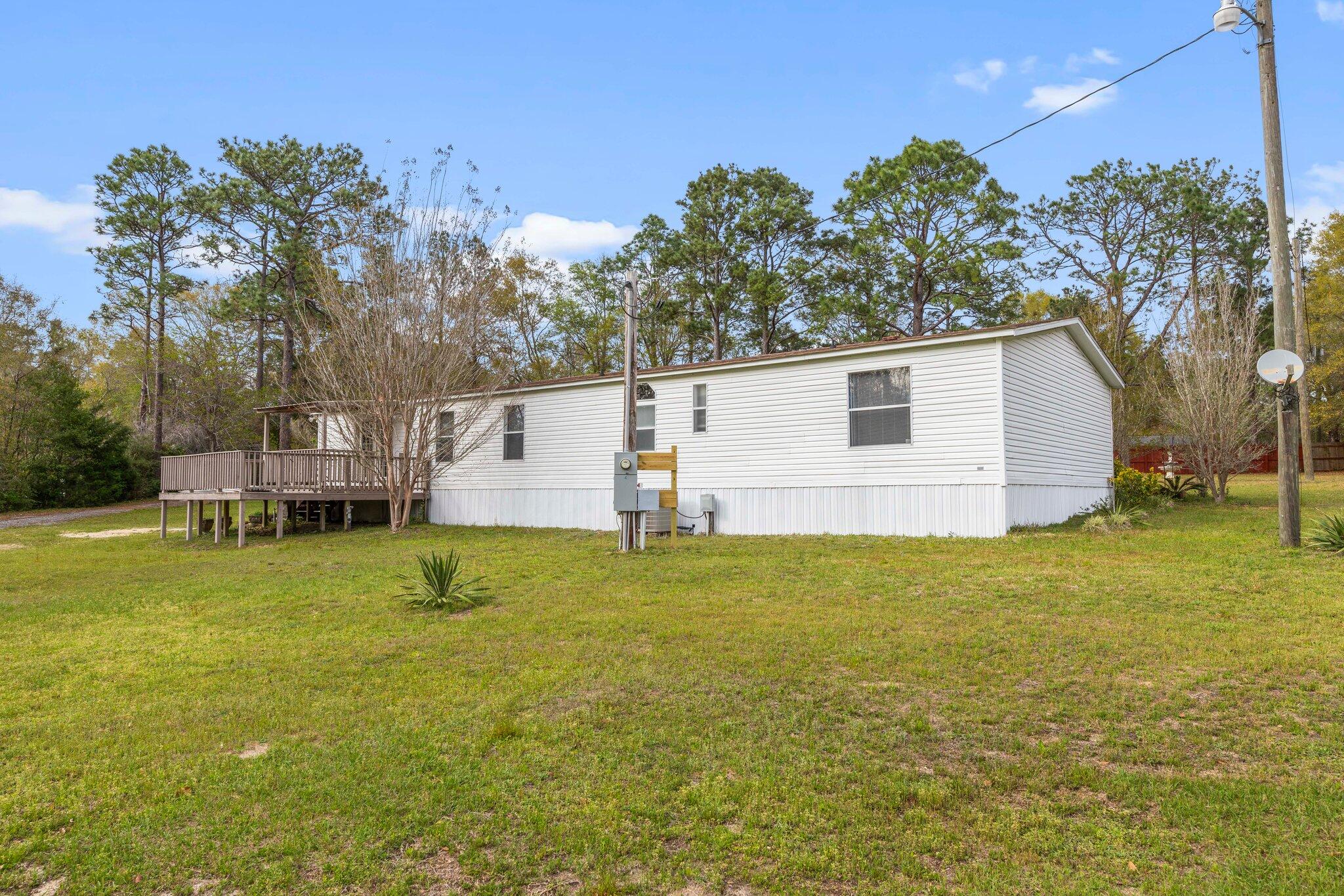 3062 Highland Avenue Crestview, FL 32539 - Photo 6 of 58 a view of backyard of house with green space