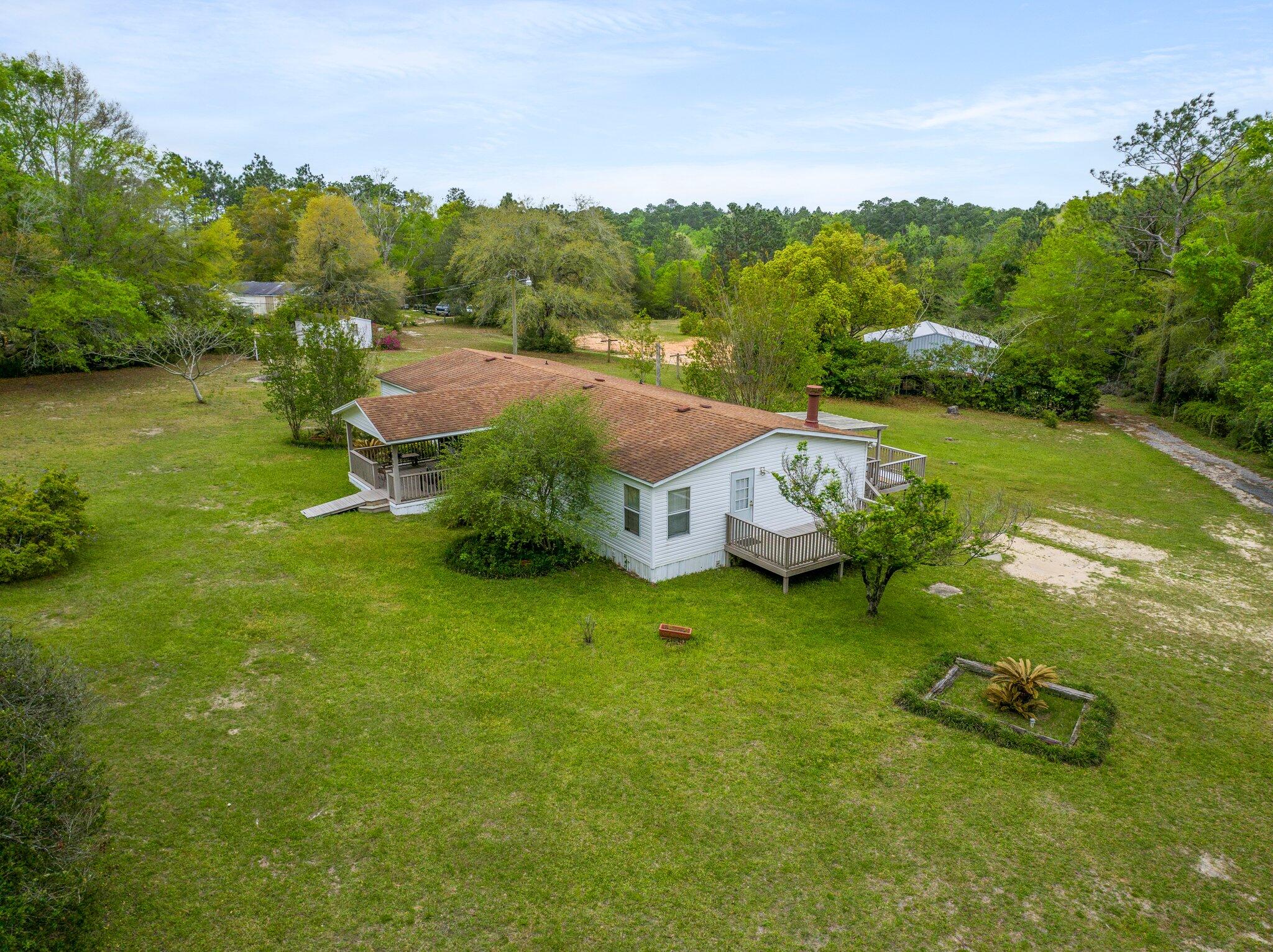 3062 Highland Avenue Crestview, FL 32539 - Photo 8 of 58 a view of a garden with houses