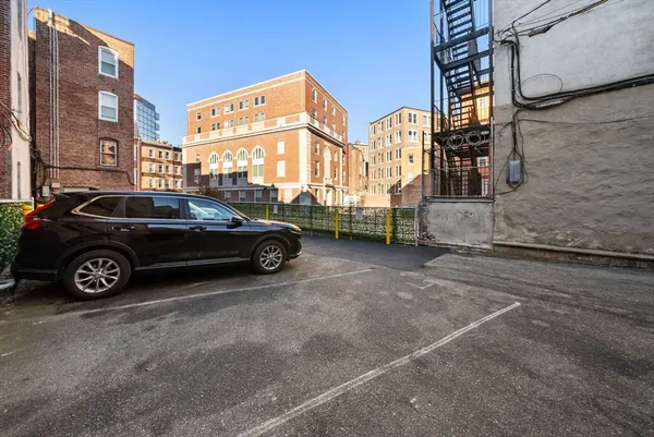 a view of a car parked in front of a building