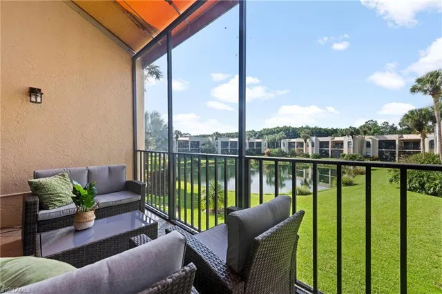 a view of a balcony with furniture