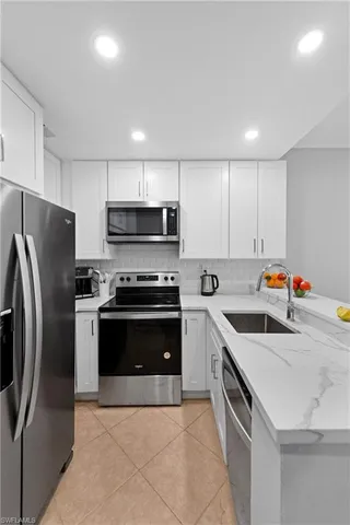 a kitchen with stainless steel appliances and a sink