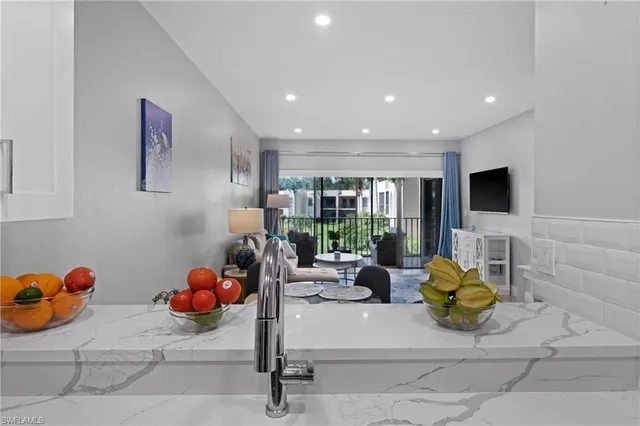 a room with a table chair and window