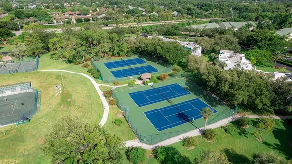an aerial view of a house with outdoor space and a lake view