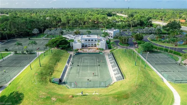 an aerial view of a house with outdoor space pool patio and lake view