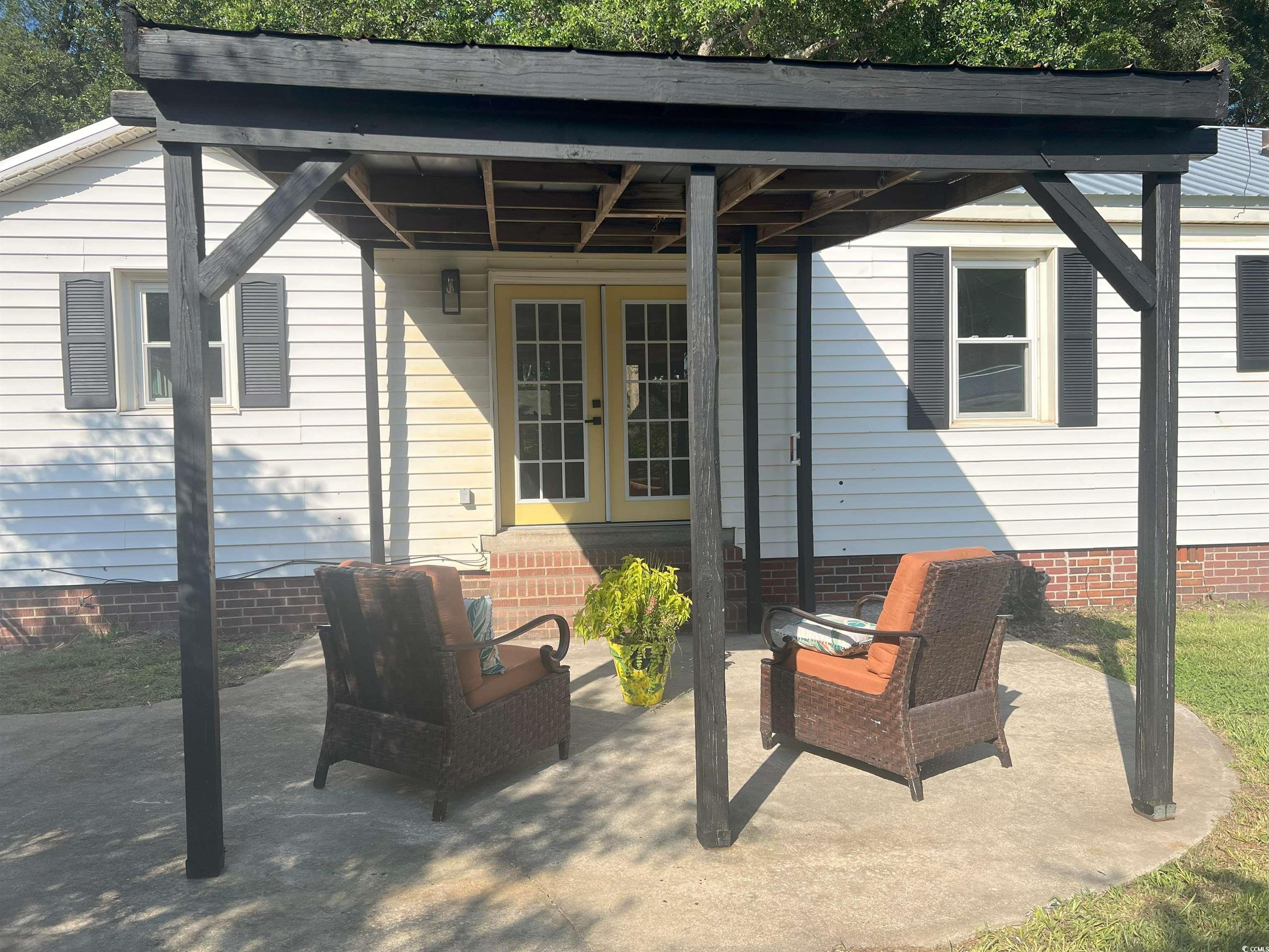 518 Nowell Street Georgetown, SC 29440 - Photo 11 of 28 View of patio with french doors and entry steps