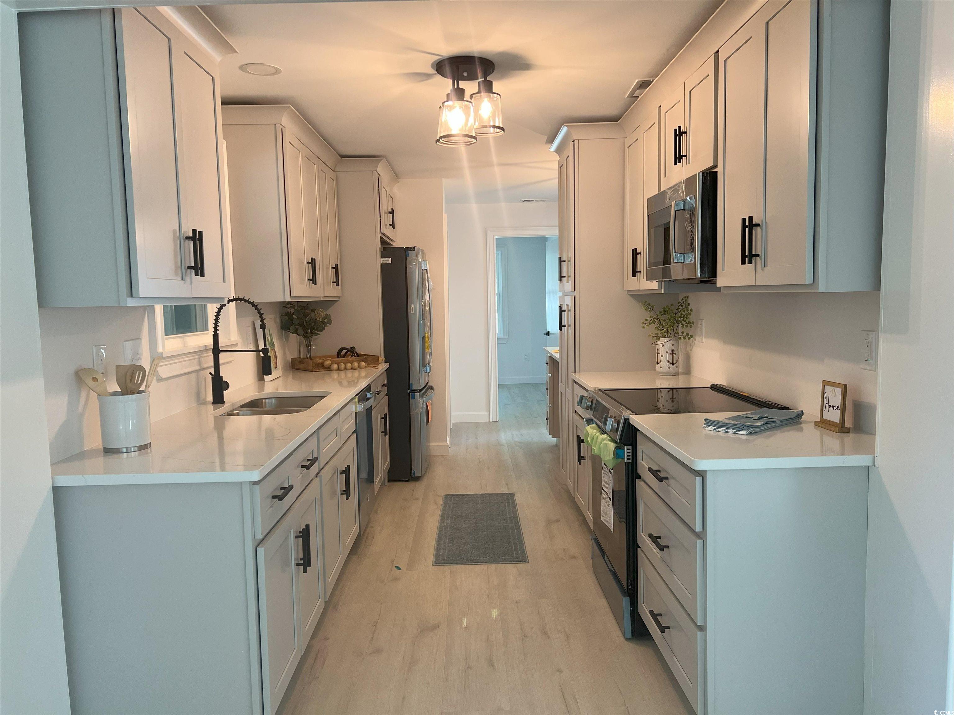 518 Nowell Street Georgetown, SC 29440 - Photo 14 of 28 Kitchen with stainless steel appliances, light cou