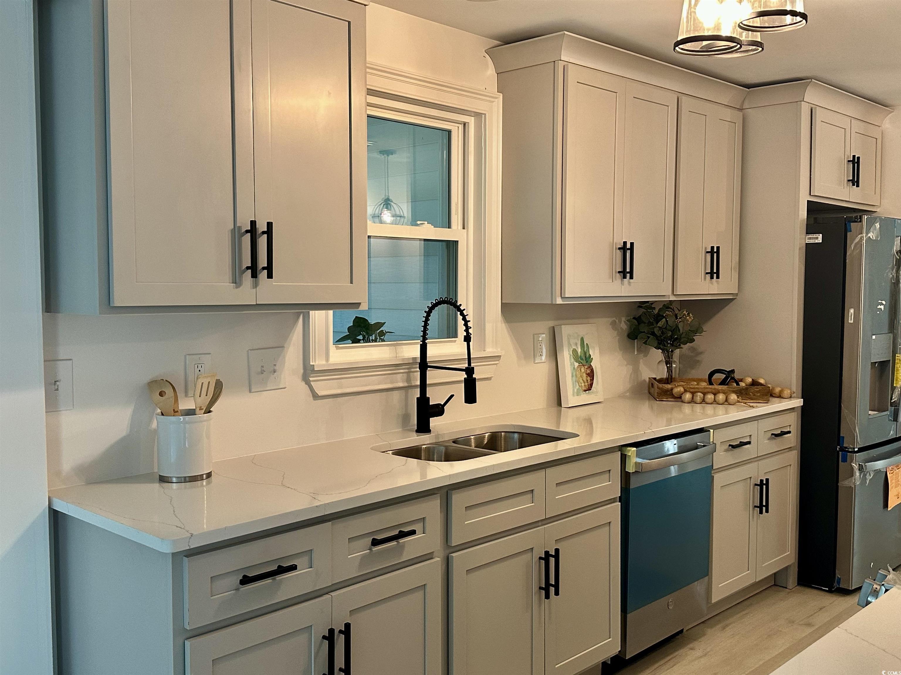 518 Nowell Street Georgetown, SC 29440 - Photo 15 of 28 Kitchen with stainless steel fridge, dishwasher, a