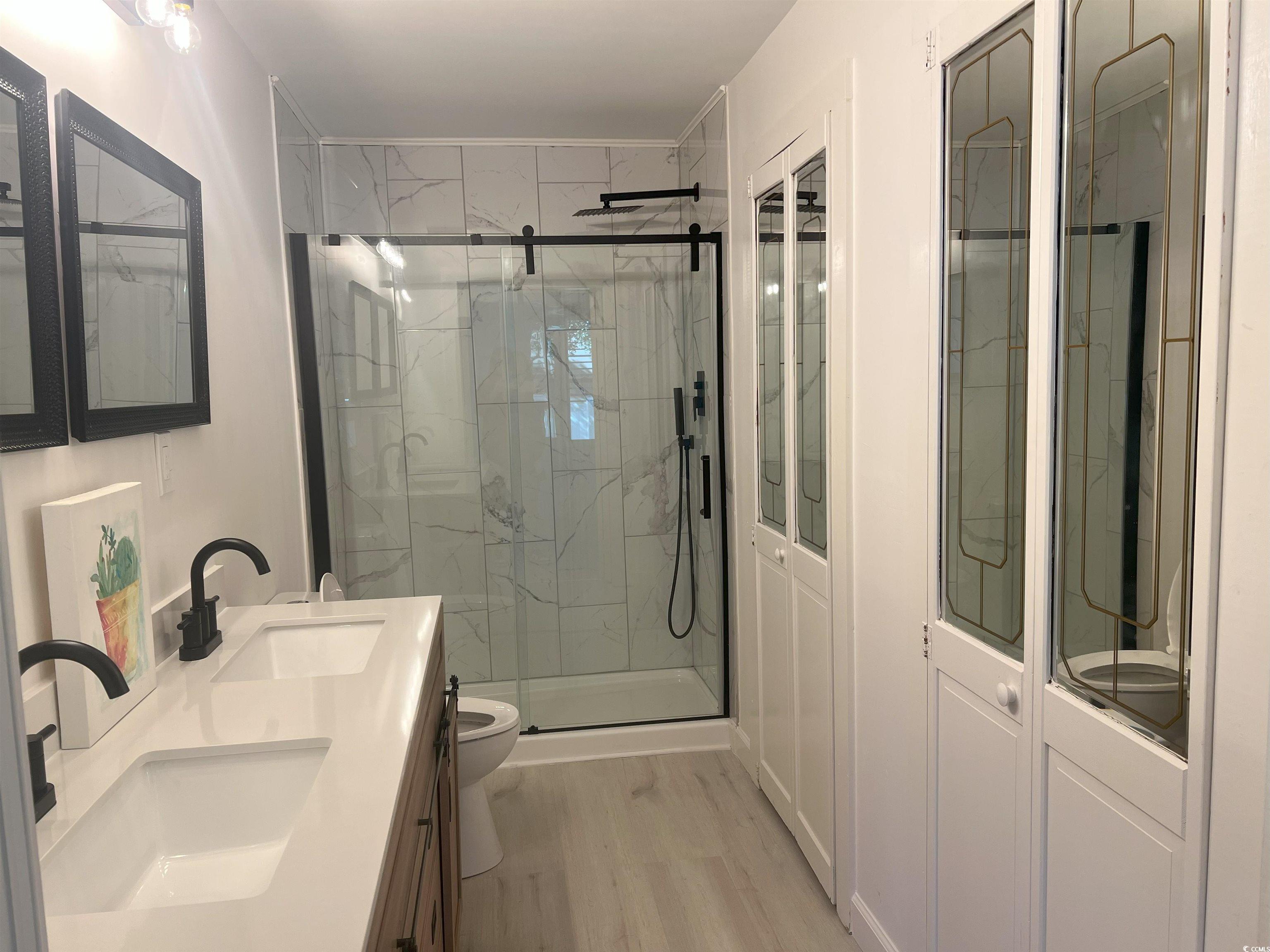 518 Nowell Street Georgetown, SC 29440 - Photo 23 of 28 Full bathroom featuring double vanity, wood finish