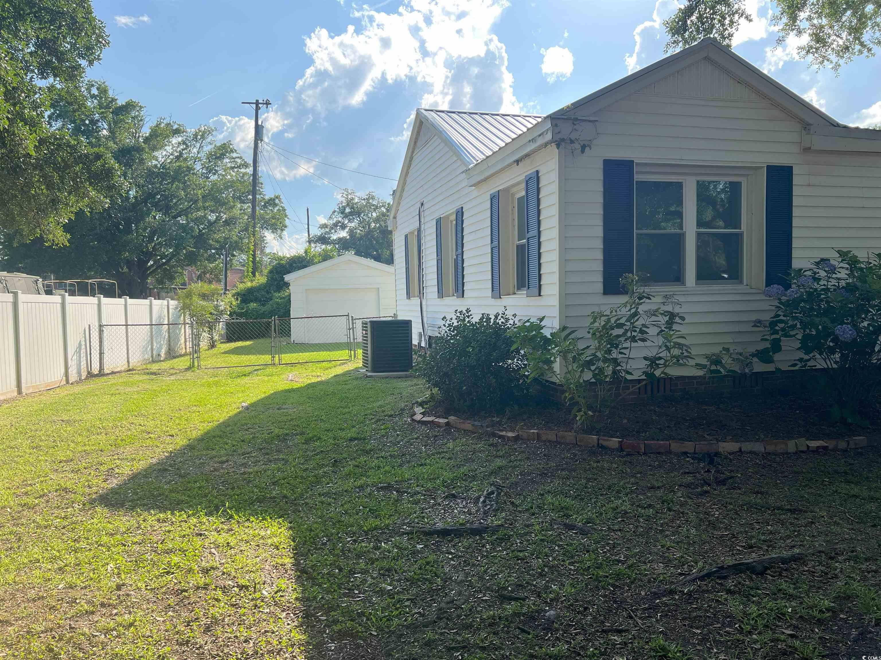 518 Nowell Street Georgetown, SC 29440 - Photo 3 of 28 View of property exterior featuring a garage and a