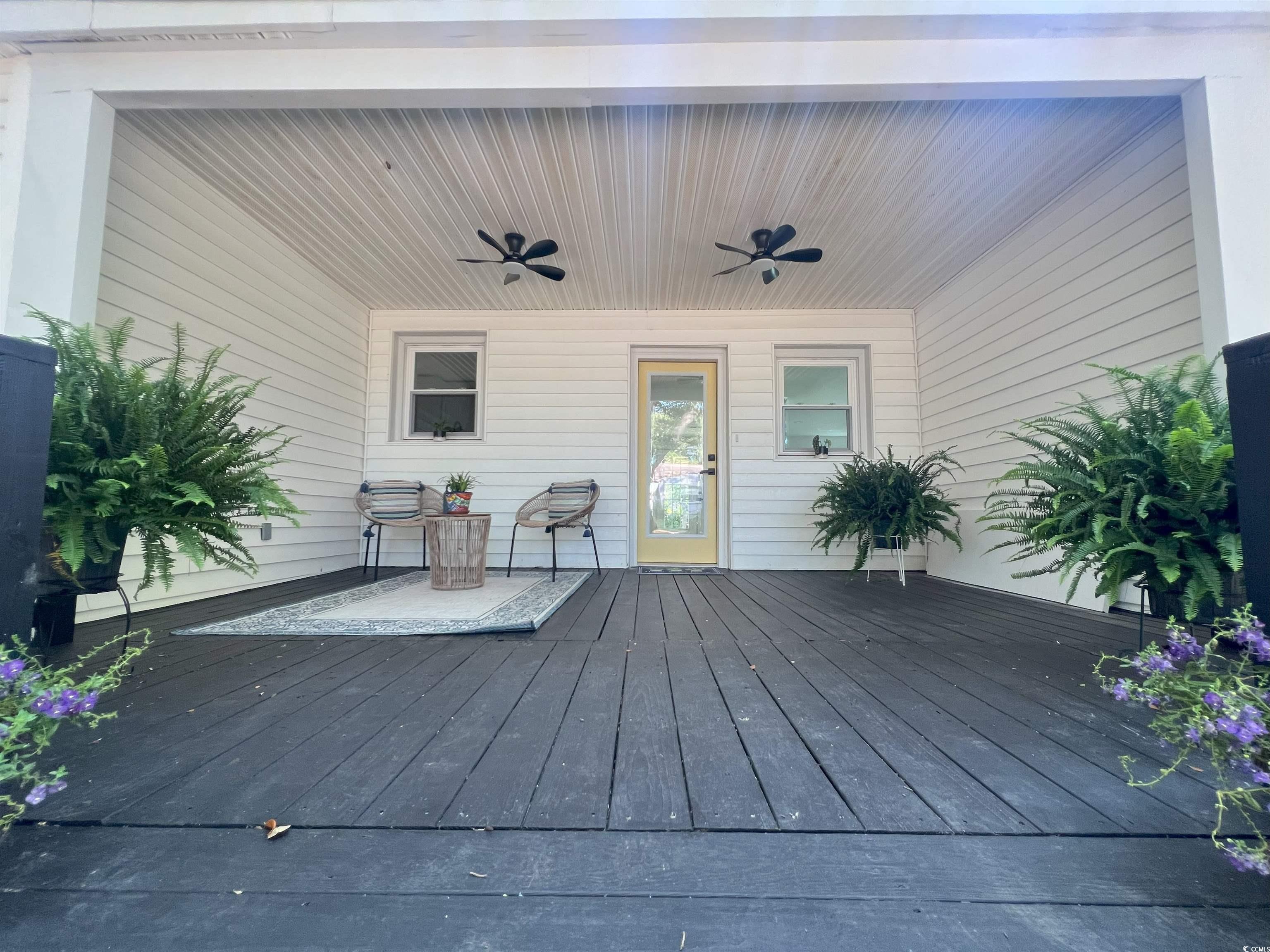 518 Nowell Street Georgetown, SC 29440 - Photo 4 of 28 Wooden deck with a ceiling fan