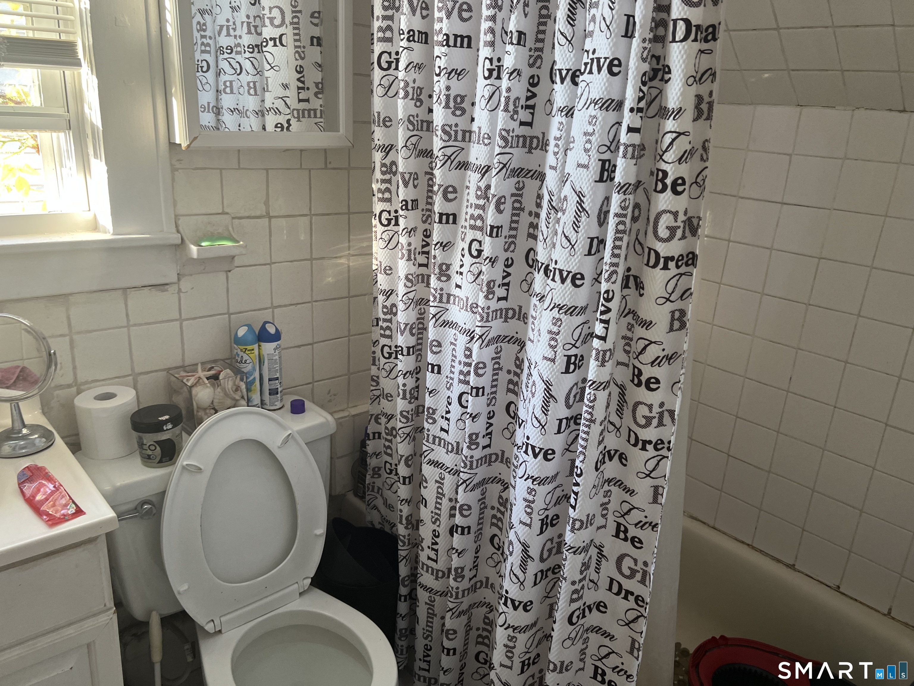 275 Long Ridge Road Stamford, CT 06905 - Photo 18 of 40 a bathroom with a toilet and a shower curtain
