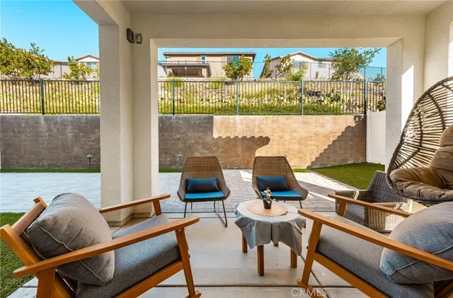 a view of backyard with a patio and a garden