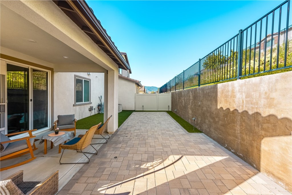 11786 Glenridge Road Corona, CA 92883 - Photo 26 of 73 a view of a patio with a table and chairs and potted plants