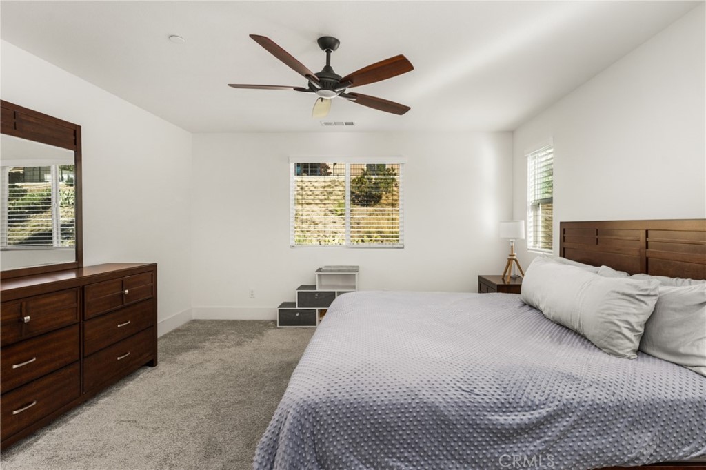 11786 Glenridge Road Corona, CA 92883 - Photo 32 of 73 a bedroom with a bed and window