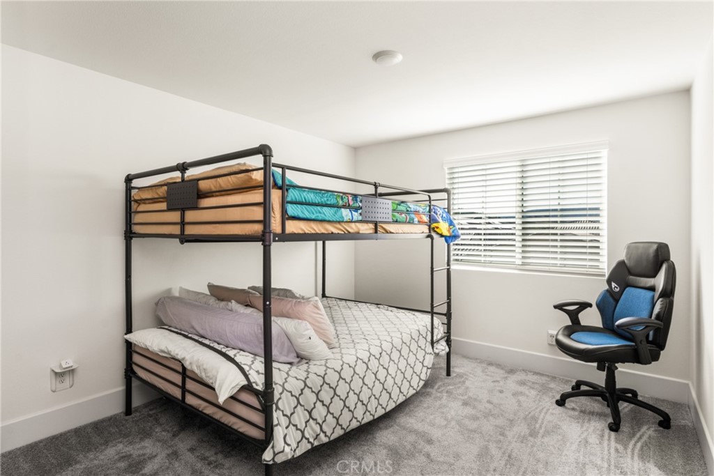 11786 Glenridge Road Corona, CA 92883 - Photo 39 of 73 a bedroom with furniture and a window