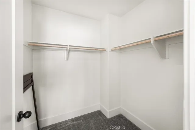 a living room with patio furniture and a floor to ceiling window