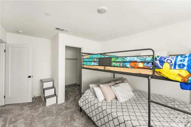 a view of a chairs and table in patio with a lake view