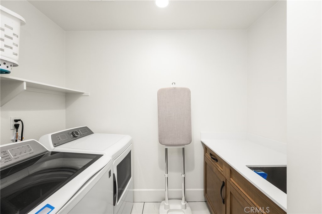 11786 Glenridge Road Corona, CA 92883 - Photo 45 of 73 a kitchen with a sink and a stove top oven