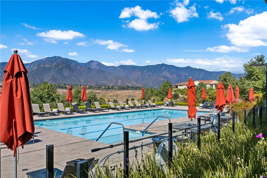 11786 Glenridge Road Corona, CA 92883 - Photo 5 of 73 a view of a chairs and table in patio with a lake view