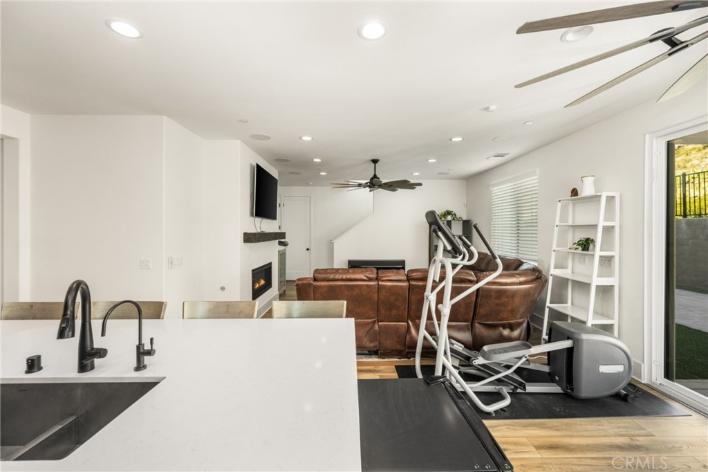 11786 Glenridge Road Corona, CA 92883 - Photo 8 of 73 a view of a kitchen with kitchen island granite countertop a sink and a large window
