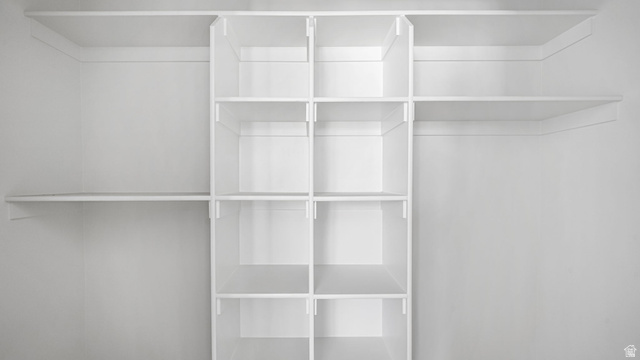 717 South Harrison Drive West Springville, UT 84663 - Photo 13 of 31 Custom white shelving system featuring multiple cubbies and hanging rods