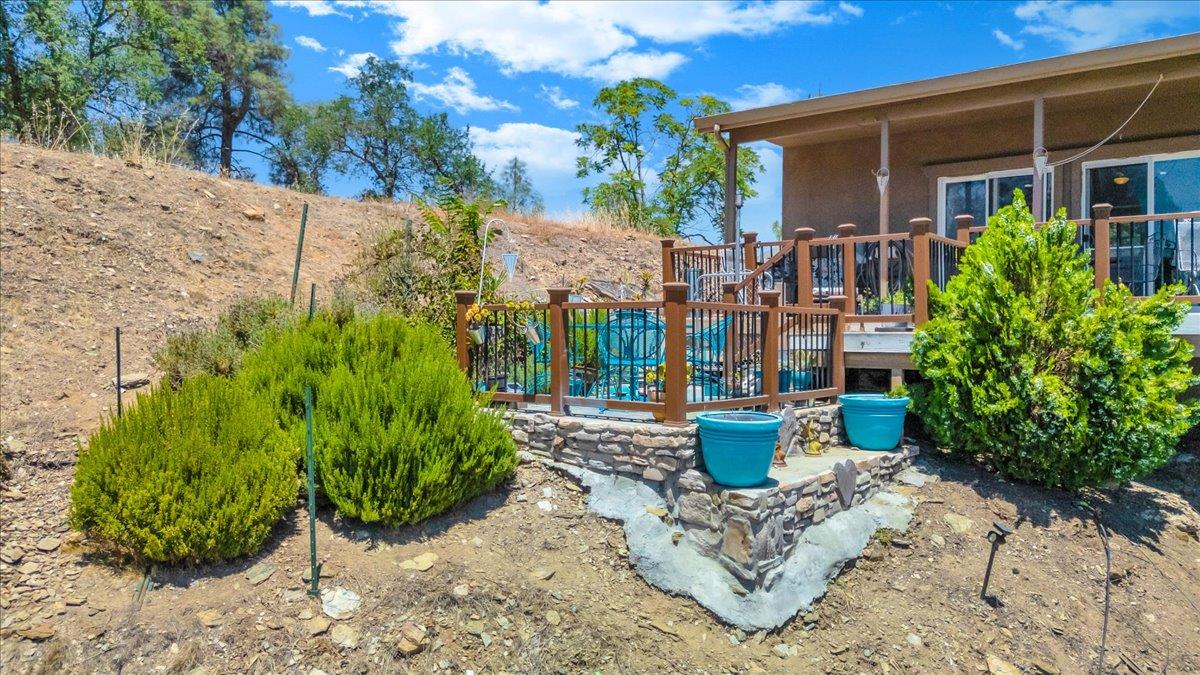 411 Sunrise Road Copperopolis, CA 95228 - Photo 17 of 76 Low-maintenance property with some pops of green foliage.