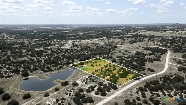 an aerial view of a residential apartment building and mountain view