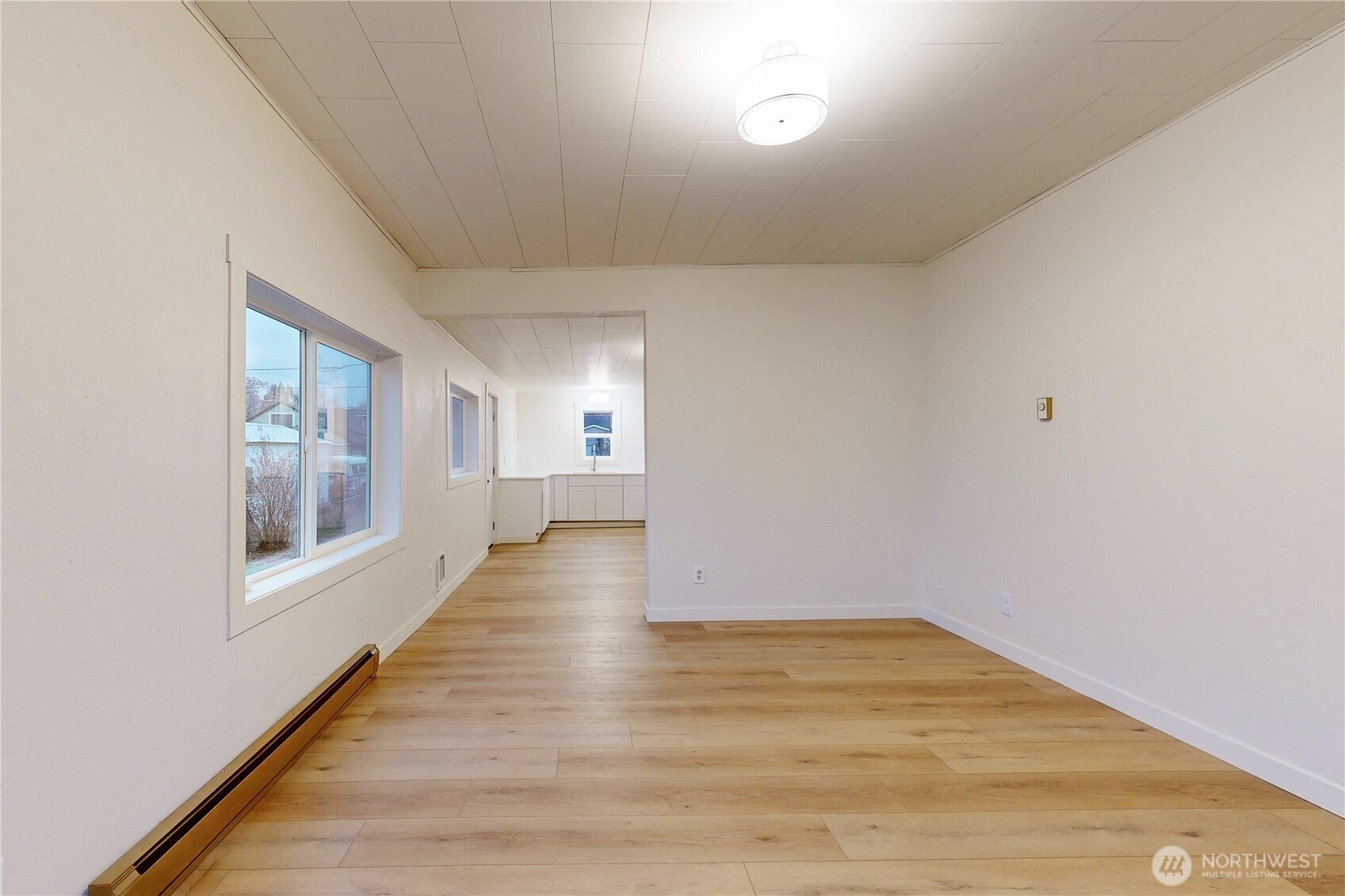 1209 Chestnut Street Milton Freewater, OR 97862 - Photo 2 of 23 a view of an empty room with wooden floor and a window