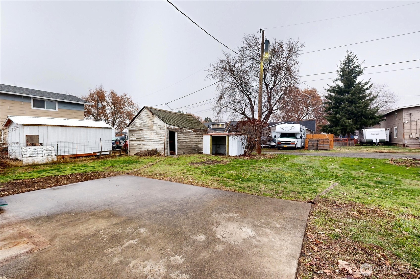 1209 Chestnut Street Milton Freewater, OR 97862 - Photo 23 of 23 a view of a house with a yard and large tree