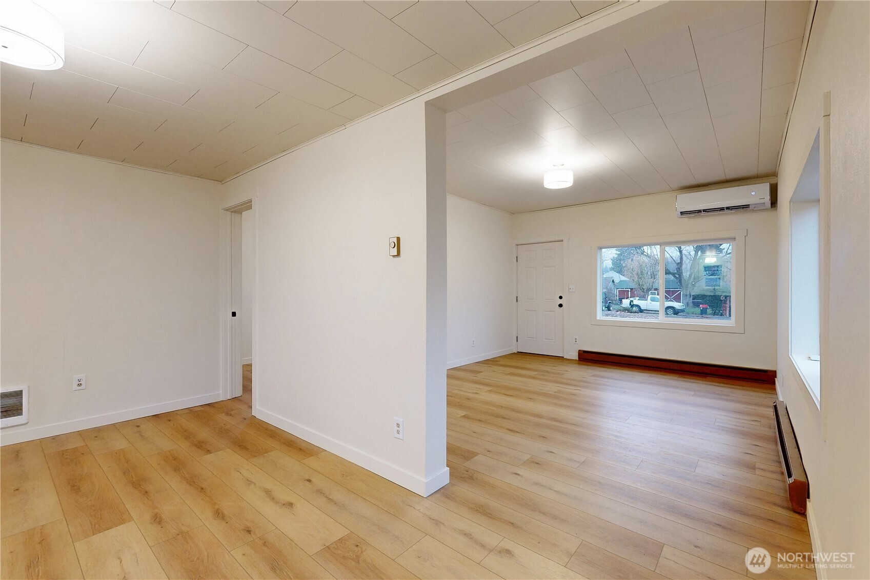 1209 Chestnut Street Milton Freewater, OR 97862 - Photo 4 of 23 an empty room with wooden floor and windows