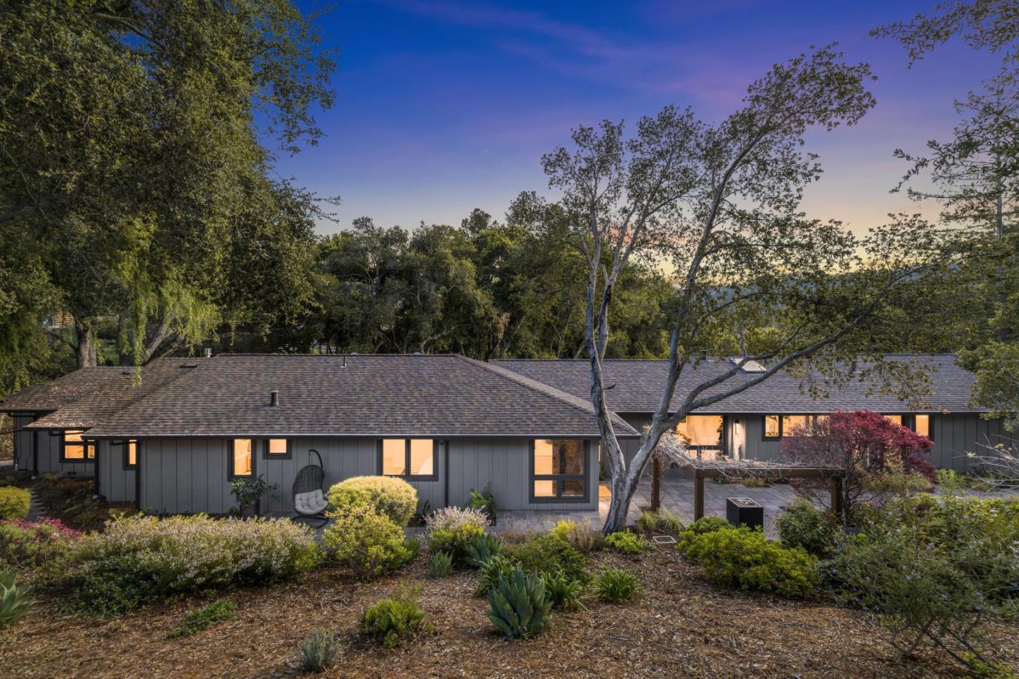 a front view of a house with garden