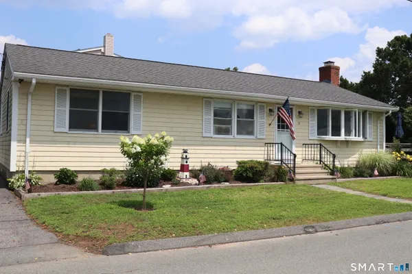 a front view of a house with a yard