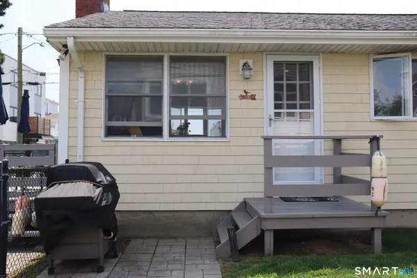 a view of house with outdoor seating space