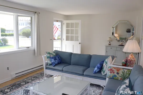 a living room with furniture and a window