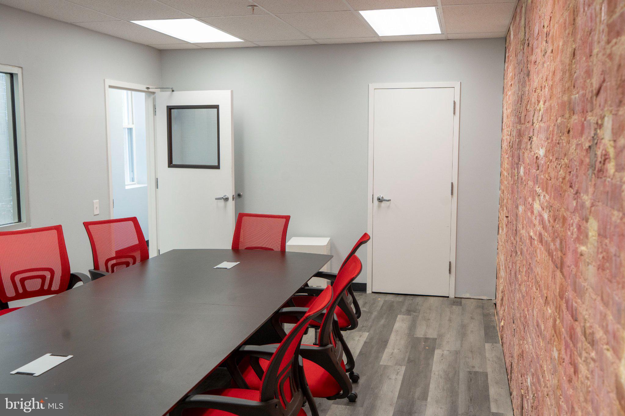 8 North Pulaski Street Baltimore, MD 21223 - Photo 5 of 25 Modern meeting space with vibrant accents.