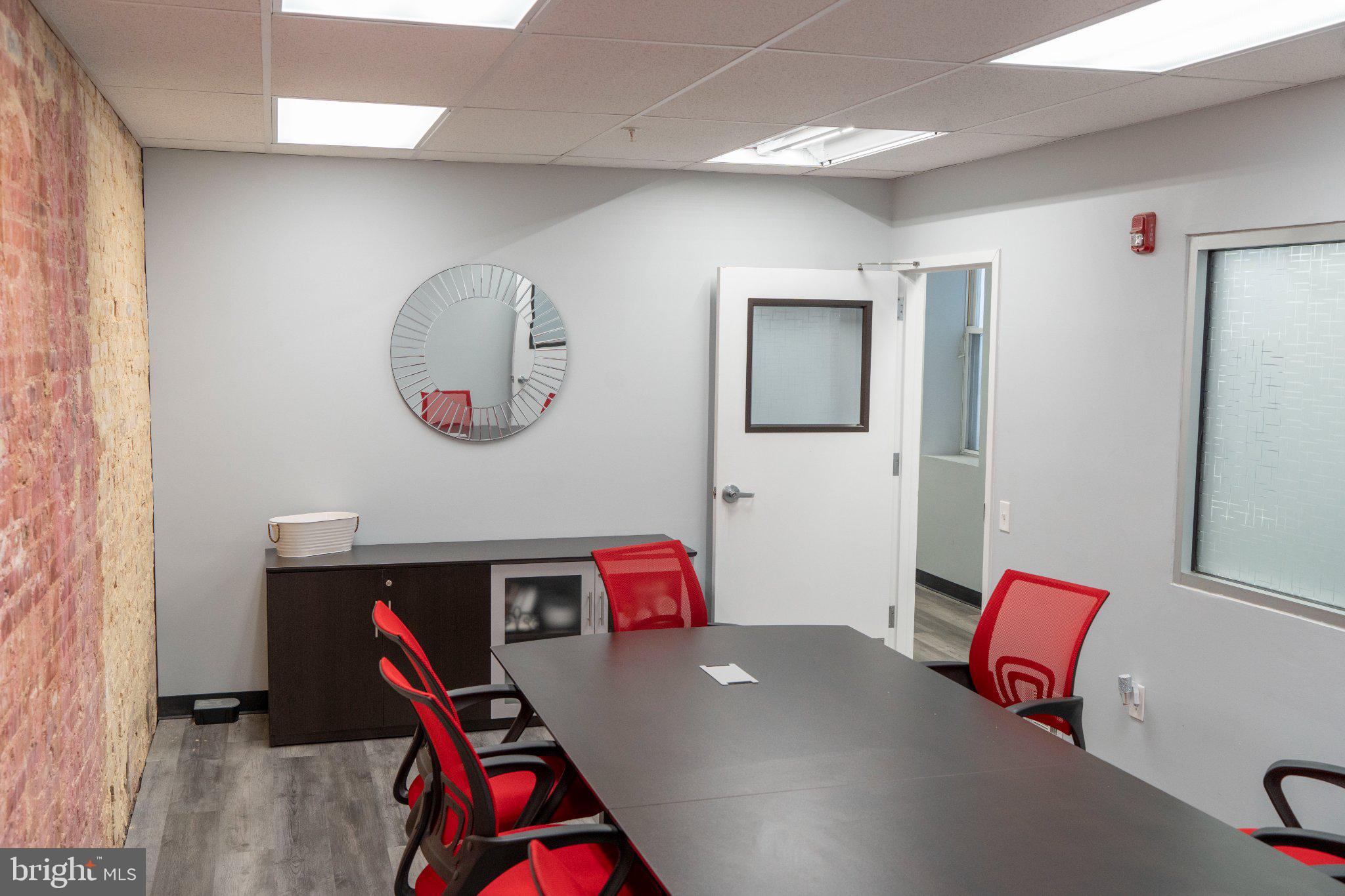 8 North Pulaski Street Baltimore, MD 21223 - Photo 6 of 25 Modern meeting space with vibrant accents.